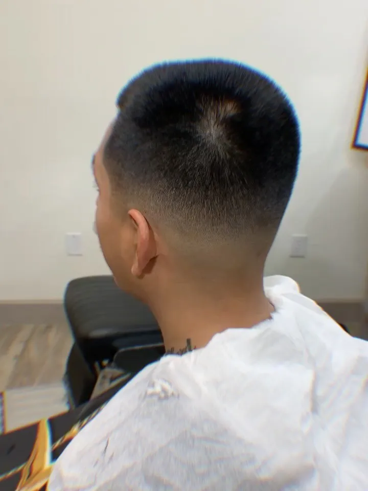 Flat top with a burst fade, cut at The Cave Hype