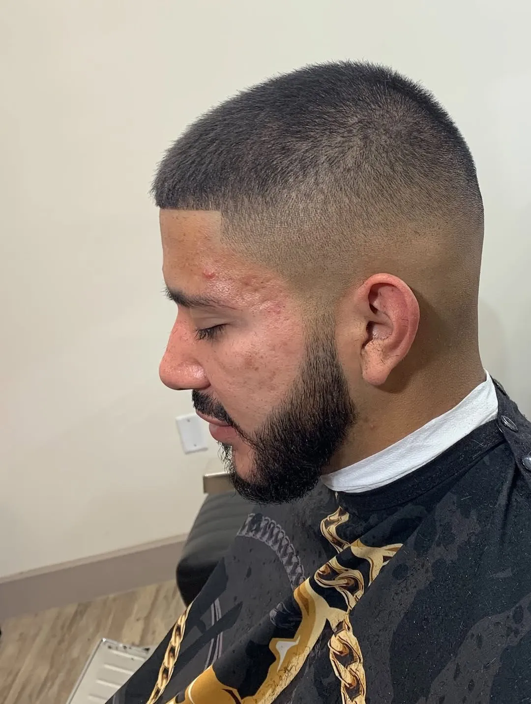 Skin fade with a shaped and lined beard, cut at The Cave Hype
